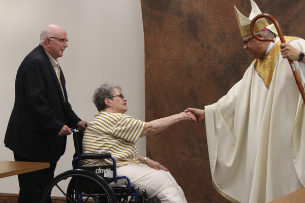 William D. Lewis\The Vindicator.Timothy and Kathleen Moriarty of St. Luke parish get greetings from Bishop George Murry after Wedding Anniversary Mass Sunday June 5, 2016 at St. Columba Cathedral in Youngstown.