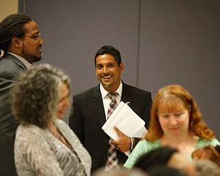        ROBERT K. YOSAY  | THE VINDICATOR..  Krish...  does some glad handing before the meeting..Krish Mohip, a Chicago schools administrator, is the first Ytown schools CEO. - -30-......