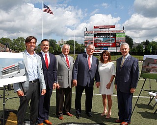        ROBERT K. YOSAY  | THE VINDICATOR..Constantini Family with jim  tressel-..Don Constantini gives 1 million for the construction of a multimedia center on the East Side of YSU Stambaugh Stadium... - -30-......