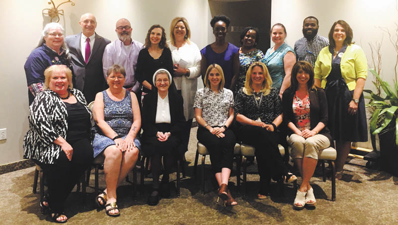SPECIAL TO THE VINDICATOR
Poland Rotary distributed funds to 15 local charities May 25 at Michael Alberini’s Restaurant in Boardman. The event is the highlight of the Rotary year learning about how many lives are touched in the Mahoning Valley. In front from left, are Maureen Pusch, Easter Seals; Marty Chandler, Yellow Brick Place; Sister Jerome, Sister Jerome’s Poorest of the Poor; Shelly Marlowe, Making Kids Count; Jodi Harmon, Potential Development; and Michelle Jones, Down Syndrome Association of the Mahoning Valley. In back are Kathleen Price, Mission of Love; Mike Iberis, Second Harvest Food Bank; Jim Sutman, Golden String; Maraline Kubic, Sister Jerome’s Poor; Liz McGarry, Hospice of the Valley; Lindsay Benton, Inspiring Minds; Andrea Walker, Sojourner House; Kathy Cristan, Mahoning County CASA/GAL; Germaine McAlpine, Boys & Girls Clubs; and Debbie Williams, Down Syndrome Association of the Mahoning Valley. Poland Rotary is a service organization comprised of local community and business leaders. Their motto is service above self. In May the club started a flag fundraiser. Participants will have flags put in their front yard for six major holidays during the year for $35. If interested, visit www.polandrotary.org.