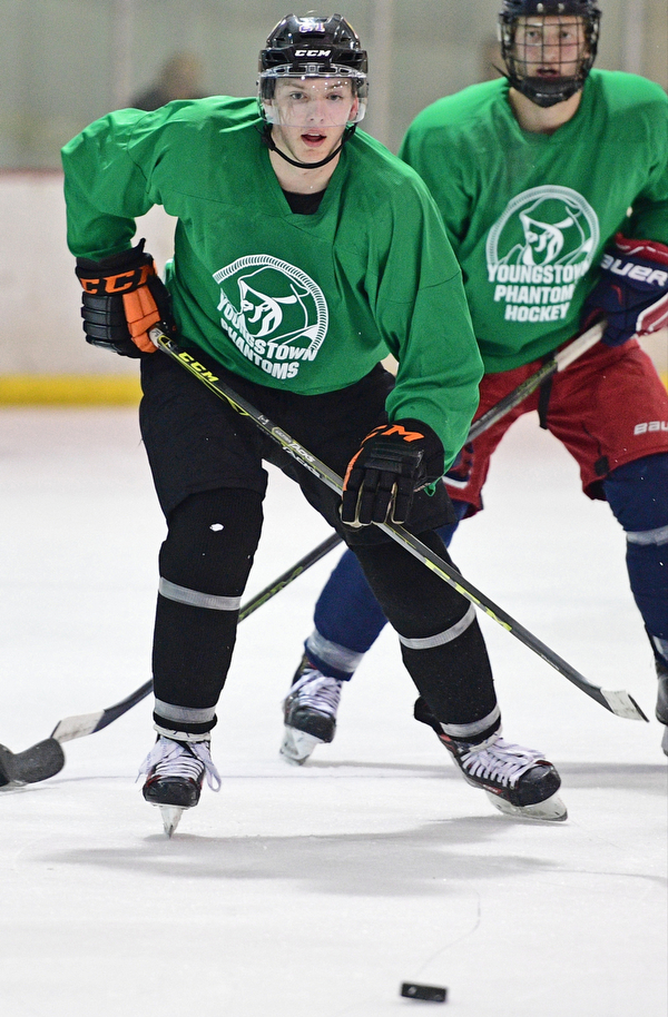 BOARD MAN, OHIO - JUNE 10, 2016: Zach Aughe (green) locates the puck after winning a face off during a exhibition game during the Phantoms prospect camp Friday night at the Ice Zone. DAVID DERMER | THE VINDICATOR