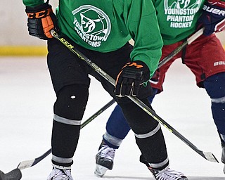 BOARD MAN, OHIO - JUNE 10, 2016: Zach Aughe (green) locates the puck after winning a face off during a exhibition game during the Phantoms prospect camp Friday night at the Ice Zone. DAVID DERMER | THE VINDICATOR