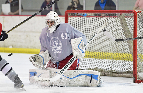 BOARD MAN, OHIO - JUNE 10, 2016: Douglas Dorr (gray) blocks the puck preventing a goal during a exhibition game during the Phantoms prospect camp Friday night at the Ice Zone. DAVID DERMER | THE VINDICATOR
