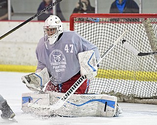 BOARD MAN, OHIO - JUNE 10, 2016: Douglas Dorr (gray) blocks the puck preventing a goal during a exhibition game during the Phantoms prospect camp Friday night at the Ice Zone. DAVID DERMER | THE VINDICATOR