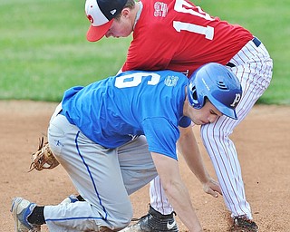 Jeff Lange | The Vindicator  FRI, JUN 10, 2016 - Mahoning County base runner Eric White of Poland Seminary (6) collides with Trumbull County's Jaret Johnson (10) of Niles McKinley as he slides safely into second base in the top of the first inning of the Valley High School All Star Classic at Eastwood Field in Niles on Friday.