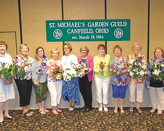 SPECIAL TO THE VINDICATOR
St. Michael Garden Guild of Canfield hosted its annual flower show, “Welcome to Ohio, the Heart of it All,” at St. Michael Church in Canfield. Lynn Hoffman of the Men’s Garden Club of Youngstown was the guest judge. The artistic division categories included State of Ohio, Ohio in Bloom, Spring Garden, Waterfalls and Rock ‘n Roll Hall of Fame. Professional and advanced categories were open to members who have won blue ribbons. Winners, from left, were Kaaren Cabraja, houseplant; Mag Mitchell, 5x5-inch little bit of bloom; Debbie Sulenski, Best of Show, horticulture, iris; Carl Cartwright, Best of Show, Springtime in Ohio foliage; Joan Fergus, hydrangea; Sue D’Agostino, spring garden; Kaye Smith, state flower, carnation; Janet Murray, Rock ‘n Roll Hall of Fame; Liz Rehlinger, first ladies arrangement; and Mary Ann Silvestri, waterfall. Flower show committee members were Murray, Doe Gallagher, Rehlinger, Cartwright and Mitchell.
