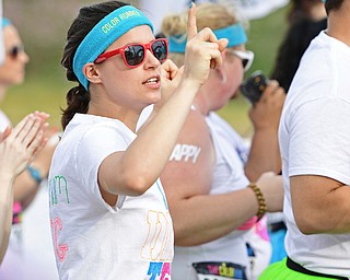 YOUNGSTOWN, OHIO - JUNE 11, 2016: Brittany Voisey of Sharpsville, Pennsylvania daces before the start of the Color Run, Saturday morning outside the Covelli Centre. DAVID DERMER | THE VINDICATOR