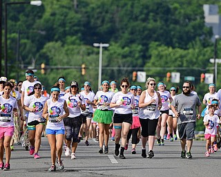 YOUNGSTOWN, OHIO - JUNE 11, 2016: Runners run down South Walnut Street during the first leg of the Color Run, Saturday morning. DAVID DERMER | THE VINDICATOR