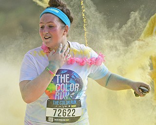 YOUNGSTOWN, OHIO - JUNE 11, 2016: Paxton Reed 12, of Niles smiles after running through a cloud of yellow powder while running down West Front Street during the Color Run, Saturday morning. DAVID DERMER | THE VINDICATOR