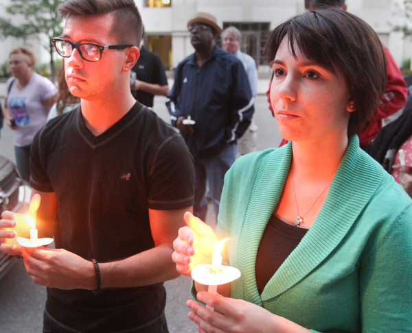 William D. Lewis the Vindicator  JRyan Kish and Paige Greene of Youngstown during a candlelight vigil in Youngsto0wn June 13, 2016 to remember Orlando shooting victims.