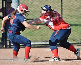 Jeff Lange | The Vindicator  TUE, JUN 14, 2016 - Austintown Fitch third baseman Alex Franken (right) applies the tag to Lordstown's Alyssa Sterle as she attempts to run back the third base in the seventh inning of game one of the 13th annual Bill Sferra Softball Classic at YSU on Tuesday.