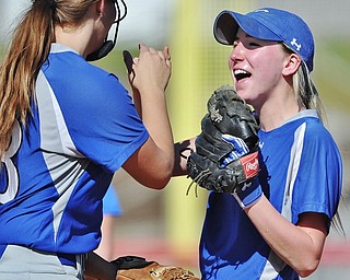 Jeff Lange | The Vindicator  TUE, JUN 14, 2016 - Poland's Kristyn Svetlak (left) and Kat Wilson celebrate in between innings as the Mahoning County All Stars win game one against Trumbull County in the 13th annual Bill Sferra Softball Classic at YSU on Tuesday.