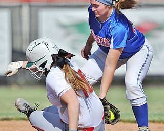 Jeff Lange | The Vindicator  TUE, JUN 14, 2016 - Western Reserve's Jenny Stubbs (right) attempts to tag Labrae's Kasey Rininger slides into second in the fourth inning of game one of Tuesday's 13th annual Bill Sferra Softball Classic at YSU.