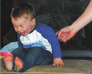 Carole Krispinsky shared this photo of her great-nephew Asher, who will be 2 this month. He and his dad, Josh Parker of Lima, Ohio, were visiting when this photo was taken. Josh got up from the ottoman to go to the kitchen and Asher scrambled up to take his place. Dad told Asher he better not be sitting there when he got back and Asher burst into giggles.