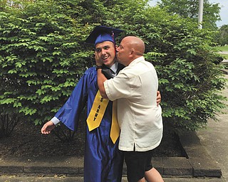 Proud father hugs his son. Sent by Noah Stevens.