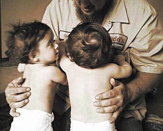 Mia and Mya Adams with dad Brett Adams from Silvis, Ill.