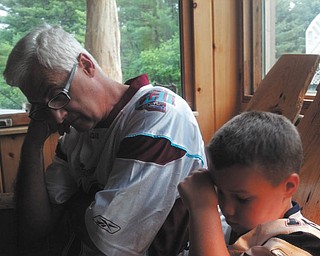 Grandpa John LoCicero of Youngstown and grandson Dane DuVall of Burlington, Maine, pause for a little rest.