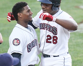 William D. Lewis/The Vindicator  Scrappers Emannuel Tapia(28) gets congrats from Erlin Cerda(4) after hitting a 5th inning home run during June 17, 2016 home opener.