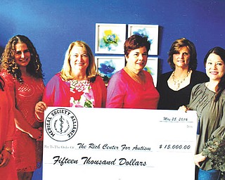 SPECIAL TO THE VINDICATOR
The Mahoning County Medical Society Alliance presented a check for $15,000 on May 25 to Melanie Carfolo, executive director of the Rich Center for Autism, during a board meeting in Canfield. The check represented proceeds from the alliance's annual charity fashion show that took place in March. Attending the presentation above were, from left, Carfolo; Bergen Giordani, development director of the Rich Center; and alliance members Carol Sankovic, Paula Jakubek, Elizabeth Roller and Diana McDonald.