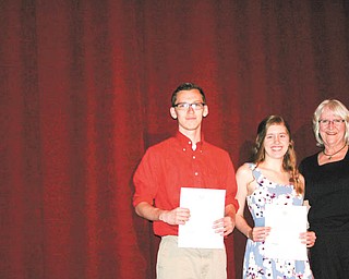 SPECIAL TO THE VINDICATOR
The Kiwanis Club of Newton Falls awarded Zachary Digman, left, and Makayla Heintz scholarships for academic excellence and community involvement at a senior awards assembly at Newton Falls High School on May 17. Members of the scholarship committee unanimously voted for the two seniors after anonymously comparing their grades, attendance, essays and volunteerism. Kathy Wujcik, right, as Kiwanis treasurer and Digman’s former teacher, presented the students with their awards and checks on behalf of the club. Students at the assembly were also given information on Circle K International, a branch of university Kiwanis service groups.