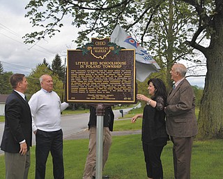 SPECIAL TO THE VINDICATOR
From left, State Rep. John Boccieri; Beau Weaver, Poland School Board president; Joanne Wollet, Poland Township trustee; and Pete Sturbi, Poland Historical Society trustee, are assisting Andy Verhoff, Ohio Fund history grant coordinator, with the unveiling May 14 of a historical marker at the Little Red Schoolhouse in the center of Poland Township.
