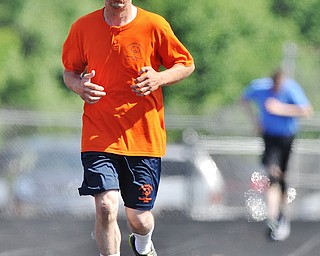 Jeff Lange | The Vindicator  SAT, JUN 18, 2016 - Columbiana County's Ron Frisbie copetes in the men's 1,500 meter run during Saturday's Special Olympics at Austintown Fitch High School.