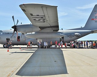 Jeff Lange | The Vindicator  SAT, JUN 18, 2016 - Visitors wait in line to tour the inside of a C-130 Hercules during the open house a the Youngstown Air Reserve Station in Vienna on Saturday.