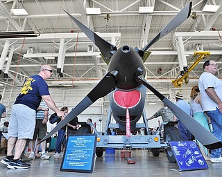 Jeff Lange | The Vindicator  SAT, JUN 18, 2016 - Carl Lemaster of Wilmington, North Carolina (left) examines a propeller from a C-130 Hercules airplane during the open house at the Youngstown Air Reserve Station in Vienna on Saturday.