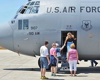 Jeff Lange | The Vindicator  SAT, JUN 18, 2016 - Brittany Fairchild (facing) gets assistance stepping out of a C-130 Hercules during an open house at the Youngstown Air Reserve Station in Vienna on Saturday.
