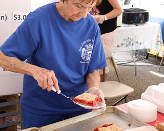 Myra Mirich of Youngstown serves strudels during the Simply Slovak festival in downtown Youngstown on Saturday afternoon.  Dustin Livesay  |  The Vindicator  6/18/16  Youngstown