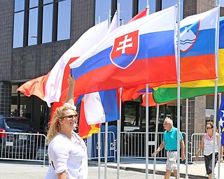  (this name is spelled right)  Jenniefer Harcarik of Warren holds out the flag of Slavakia for a picture during the Simply Slovak festival in downtown Youngstown on Saturday afternoon.  Dustin Livesay  |  The Vindicator  6/18/16  Youngstown