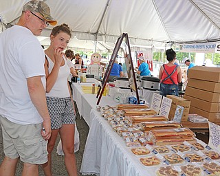 L-R) Brian Grimm of Kent looks through baked goods with his daughter Audra Grimm during the Simply Slovak festival in downtown Youngstown on Saturday afternoon.  Dustin Livesay  |  The Vindicator  6/18/16  Youngstown