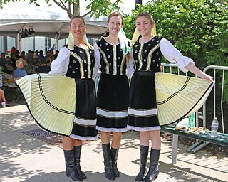 L-R) Traditional Slovak dancers, Mary Chudy, Kristyn Nosek, and Katie Hearn all of Cleveland, pose for a picture before taking the stage at the Simply Slovak festival in downtown Youngstown on Saturday afternoon.  Dustin Livesay  |  The Vindicator  6/18/16  Youngstown