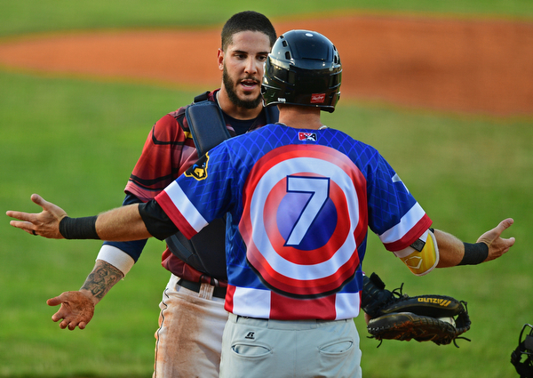 NILES, OHIO - JUNE 18, 2016: Catcher Juan Gomes #11 of the Scrappers confronts Erik Forgione #7 of the Black Bears after a collision at home plate forced out Forgione in the sixth inning of Saturday nights game at Eastwood Field. DAVID DERMER | THE VINDICATOR