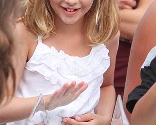 William D. Lewis/The Vindicator The 55 th annual Turtle Races sponsored by the Youngstown Lions Club were held in Lowellville Monday June, 20,2016. Urging her turtle to victory is Audrey Solvesky, 8, of Boardman.