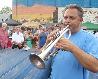 William D. Lewis/The Vindicator The 55 th annual Turtle Races sponsored by the Youngstown Lions Club were held in Lowellville Monday June, 20,2016. Trumpeter Joe Ballone of Lowellville cals the turtles to the start