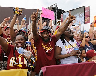 Cleveland Cavaliers fans celebrate as they wait for the team's arrival in Cleveland, Monday, June 20, 2016. Lebron James came home with the trophy he promised, and the championship Cleveland has coveted for 52 years. The NBA superstar, born and raised in nearby Akron, stepped off a plane Monday and hoisted the shiny Larry O'Brien Trophy as more than 10,000 fans celebrated the city's first title since 1964. (AP Photo/Tony Dejak)