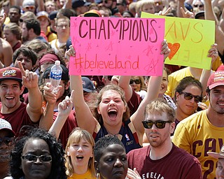 Cleveland Cavaliers fans cheer as they wait for the team's arrival in Clevleand, Monday, June 20, 2016. Lebron James came home with the trophy he promised, and the championship Cleveland has coveted for 52 years. The NBA superstar, born and raised in nearby Akron, stepped off a plane Monday and hoisted the shiny Larry O'Brien Trophy as more than 10,000 fans celebrated the city's first title since 1964. (AP Photo/Tony Dejak)