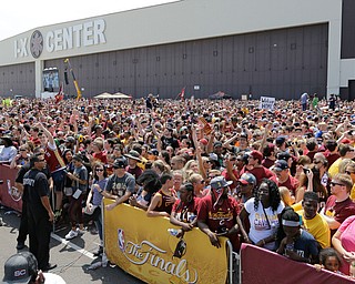 A large crowd of Cleveland Cavaliers fans wait for the arrival of the team in Cleveland, Monday, June 20, 2016. Lebron James came home with the trophy he promised, and the championship Cleveland has coveted for 52 years. The NBA superstar, born and raised in nearby Akron, stepped off a plane Monday and hoisted the shiny Larry O'Brien Trophy as more than 10,000 fans celebrated the city's first title since 1964. (AP Photo/Tony Dejak)