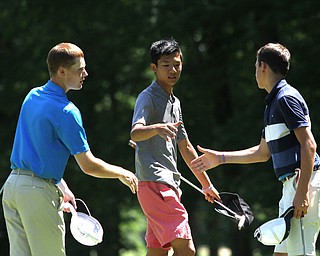 Nikos Frazier | The Vindicator..(left to right) Keegan Butler, of Canfield, Nick Li, of Beijing, China, and Andrew Wallace of Narberth, Pa. shake hands after the Mill Creek Foundation Junior All-Star.