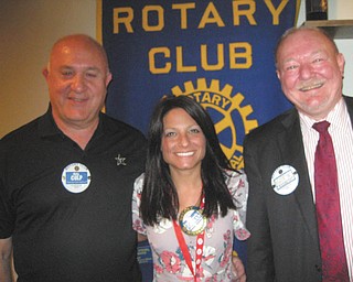 SPECIAL TO THE VINDICATOR
Stephanie Fabian, an Austintown Schools registrar, was inducted into the Austintown Rotary Club on June 6. A native of Campbell, Fabian is a Youngstown State University alumni and works in the Austintown Early Learning Center. Club president Mal Culp, left, sponsored her membership and Rotarian Chuck Baker, right, completed the induction ceremony. Rick Rowlands of the Youngstown Steel Heritage Foundation was speaker at the meeting. Rowlands discussed working with Youngstown Sheet and Tube to save the 260-ton Tod Stationary Engine from destruction, as well as the 1995 construction of a building at 2261 Hubbard Road, Youngstown, to house the engine along with locomotives, hot metal cars and other steel manufacturing machinery. Rowlands also invited the public to the museum’s open house from 9 a.m. to 4 p.m. Sept. 17.