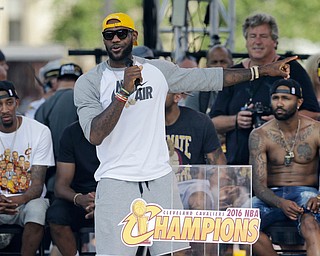 Cleveland Cavaliers' LeBron James talks about his teammates during a rally, Wednesday, June 22, 2016, in Cleveland. The Cavaliers made history by overcoming a 3-1 deficit to beat the Golden State Warriors in the NBA Finals and end the city's 52-year drought without a professional sports championship. (AP Photo/Tony Dejak)