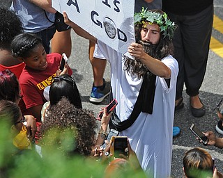 CLEVELAND, OHIO - JUNE 22, 2016: A fan dressed up as a religious figure holds a sign showing his admiration for LeBron James before the Cavaliers Championship Parade. DAVID DERMER | THE VINDICATOR