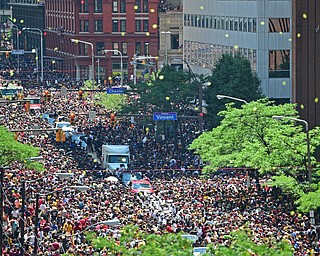CLEVELAND, OHIO - JUNE 22, 2016: Parade floats work to progress down East 9th Street through the mass amounts of people during the Cavaliers Championship Parade Wednesday afternoon. DAVID DERMER | THE VINDICATOR