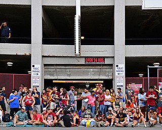 CLEVELAND, OHIO - JUNE 22, 2016: Cavaliers fans hang out near the starting point of the parade on Huron Road in front of Quicken Loans Arena around 6:30am Wednesday morning before the Cavaliers championship parade. DAVID DERMER | THE VINDICATOR