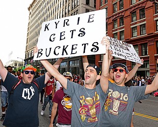 CLEVELAND, OHIO - JUNE 22, 2016: Zach Berger of Orange, Ohio (center) and Noah Ickowizc of Beachwood (right) rile up fans while walking down East 9th Street while holding signs Wednesday morning before the Cavaliers championship parade. DAVID DERMER | THE VINDICATOR