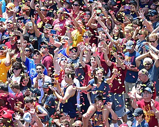 CLEVELAND, OHIO - JUNE 22, 2016: Cleveland Cavaliers fans celebrate while the confetti falls onto them during the Cavaliers Championship Parade Wednesday afternoon. DAVID DERMER | THE VINDICATOR