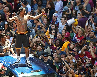 CLEVELAND, OHIO - JUNE 22, 2016: J.R. Smith of the Cleveland Cavaliers smiles while fans chant his name while he waves to the during the Cavaliers Championship Parade Wednesday afternoon. DAVID DERMER | THE VINDICATOR