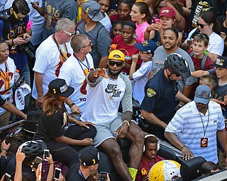 CLEVELAND, OHIO - JUNE 22, 2016: LeBron James waives to the fans while he rides down East 9th Street during the Cavaliers Championship Parade Wednesday afternoon. DAVID DERMER | THE VINDICATOR