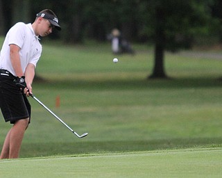 Nikos Frazier | The Vindicator..Cole Christman, of Canfield, chips the ball onto the green.